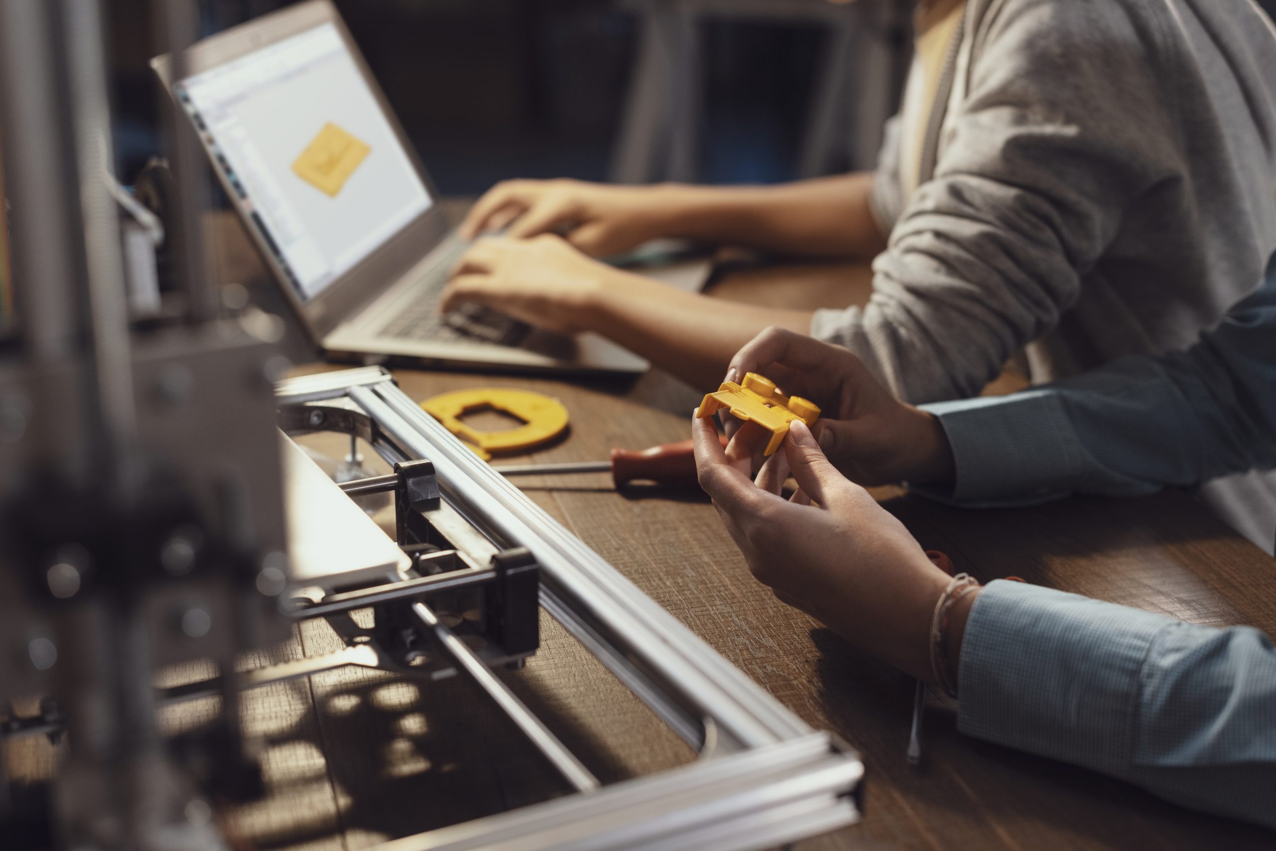 Students using a 3D printer